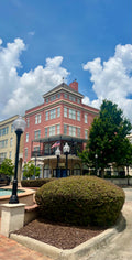 Plaza with three lamps and building