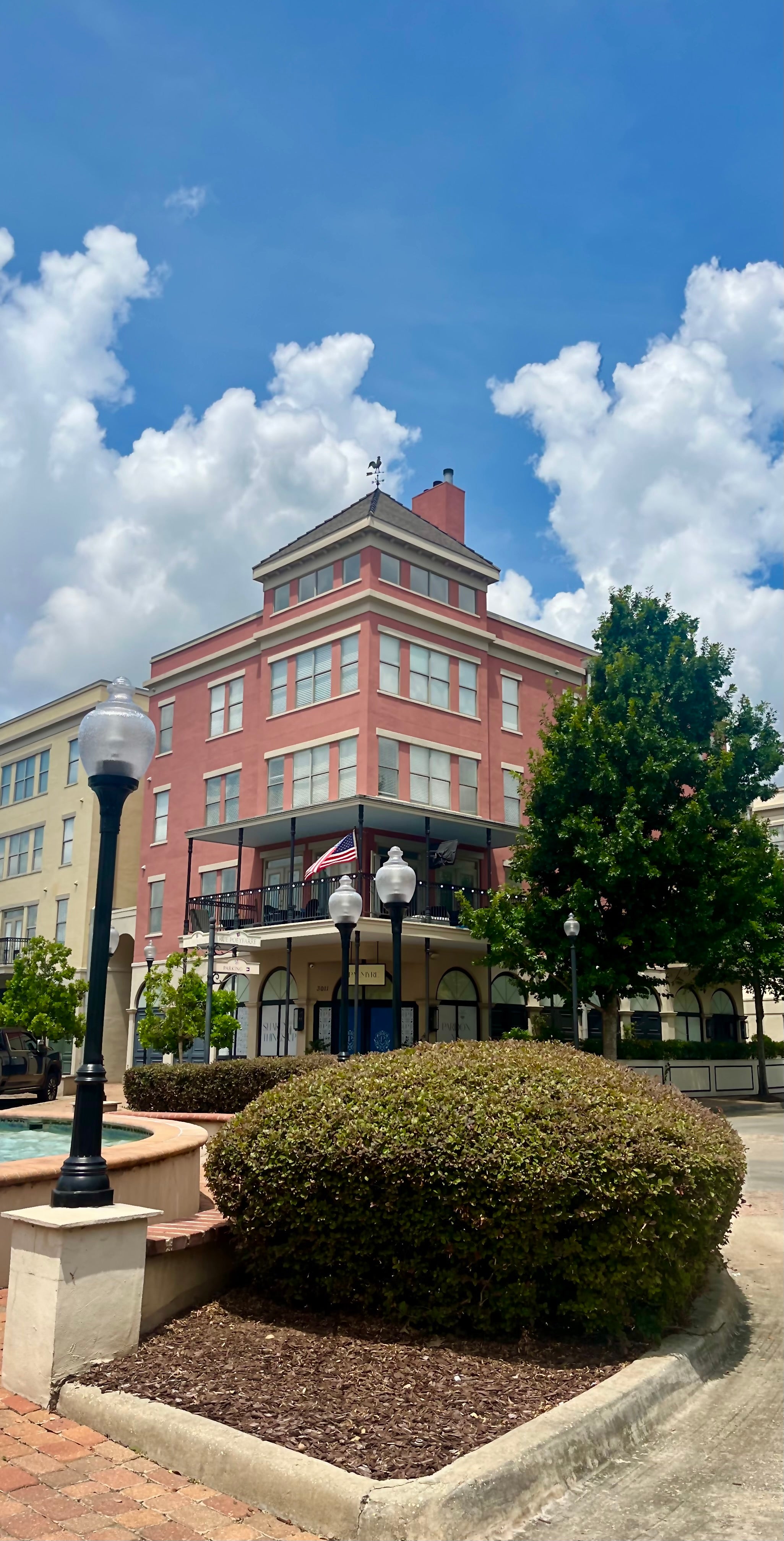 Plaza with three lamps and building